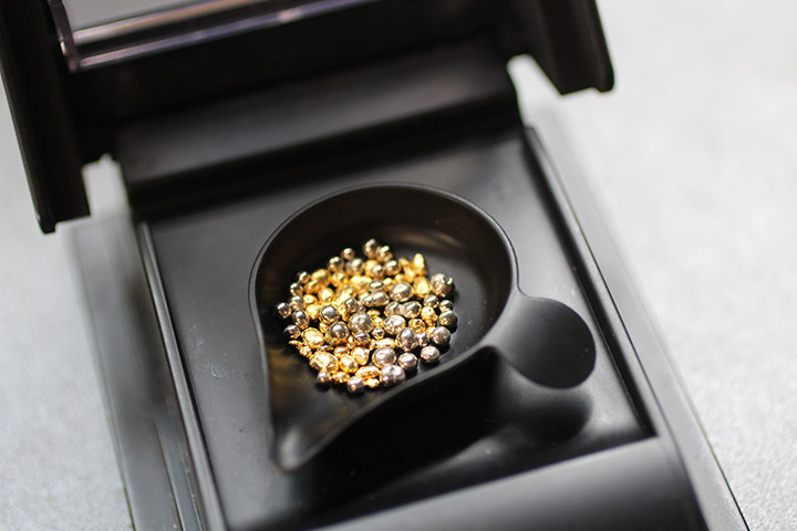 24K gold must be alloyed before it is formed into a ring. Here, proper alloy is added to create an 18K yellow gold ring.