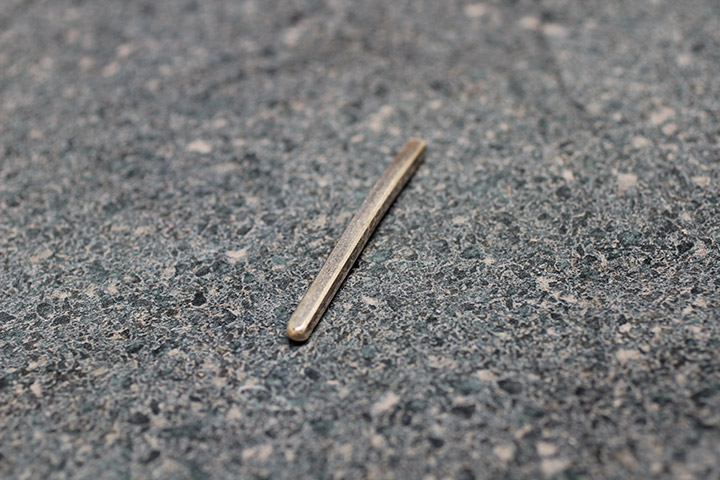 This rolled out gold from an old wedding ring is ready to be reshaped into a new wedding ring, engagement ring, or other piece of jewelry.